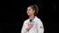 Japan, Chiba, Anastasija Zolotic (USA) celebrates on the podium after winning gold in women's 57kg taekwondo 