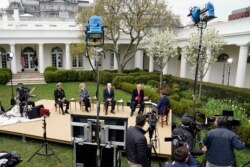 President Donald Trump speaks with Fox News Channel Anchor Bill Hemmer during a Fox News Channel virtual town hall, at the White House, in Washington, March 24, 2020.