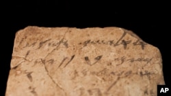 Letters inscribed on pottery, known as ostracons, which were unearthed in an excavation of a fort in Arad, Israel, and dated to about 600 B.C. shortly before Nebuchadnezzar’s destruction of Jerusalem, are seen in Israel Museum in Jerusalem on April 12, 2016.