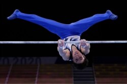 Kohei Uchimura, of Japan, competes on the horizontal bar during the men's artistic gymnastic qualifications at the 2020 Summer Olympics, July 24, 2021, in Tokyo, Japan.