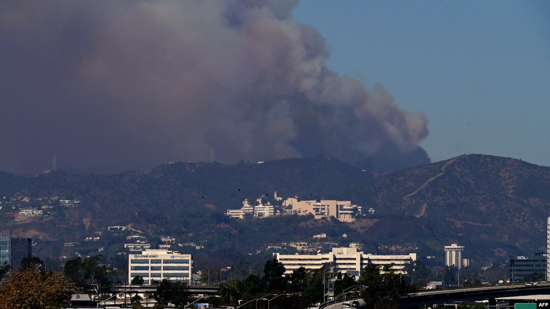 Smoke from the Palisades Fire rises over the Getty Museum in Los Angeles, Jan. 11, 2025.