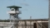 FILE - A guard tower stands above a maximum security prison in South Carolina.