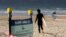 A sign tells surfers to leave once they have finished surfing at Bondi Beach in Sydney, April 28, 2020, as coronavirus pandemic restrictions are eased.