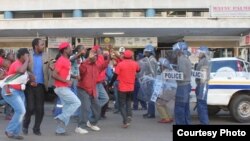 Mr. Morgan Tsvangirai abandoned his Bulawayo visit after police stormed his party headquarters in Harare.