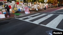 A sign is stuck on a street at Black Lives Matter Plaza after early results of the 2020 U.S. presidential election were announced, near the White House in Washington, Nov. 4, 2020.