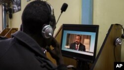 FILE: An Ethiopian streams a video of PM Abiy Ahmed speaking, at an internet cafe in Addis Ababa. Taken Nov. 26, 2020. 