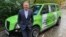 FILE - Australian mining billionaire Andrew Forrest poses in front of a taxi promoting green hydrogen clean energy alternatives, in London, Britain, Oct. 25, 2021.