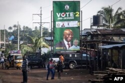 FILE - An election campaign banner for the opposition candidate Joe Boakai is seen on the street in Monrovia, on October 5, 2023.