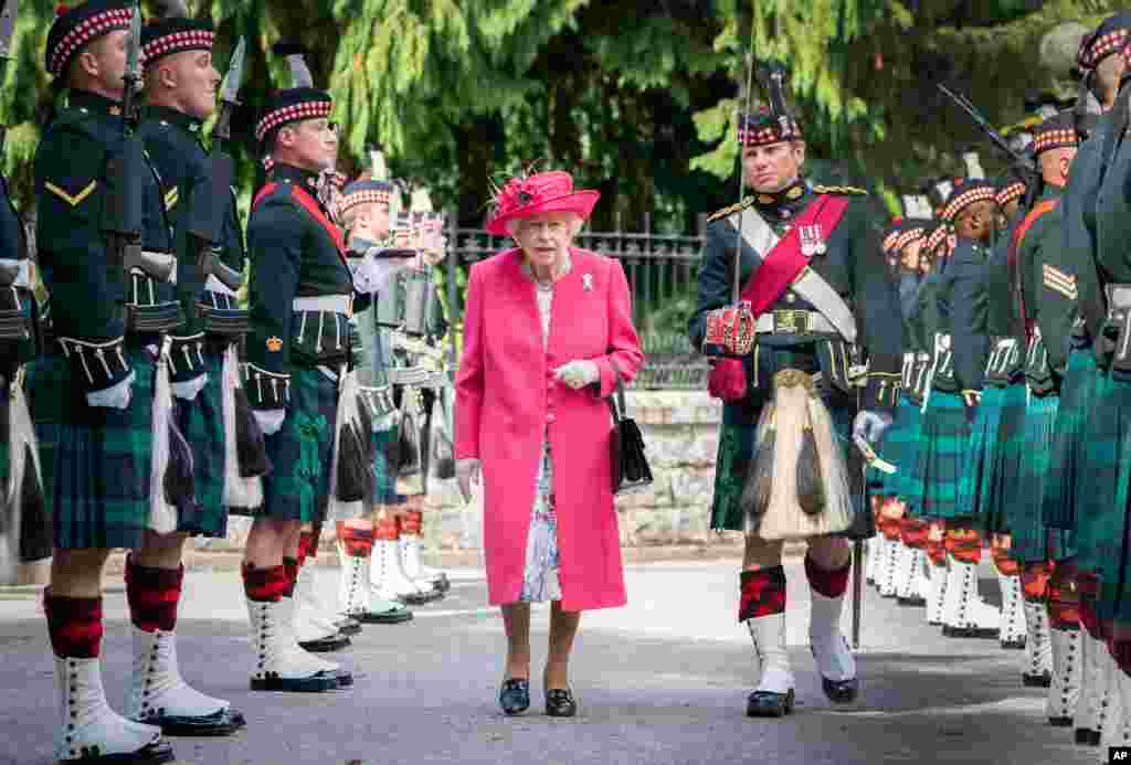 Britain&#39;s Queen Elizabeth II inspects the 5 Battalion The Royal Regiment of Scotland at the gates at Balmoral, Scotland, as she takes up summer residence at the castle.