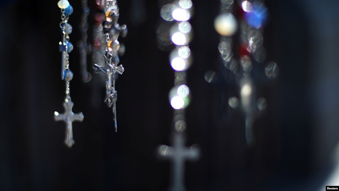 FILE - Crucifix are seen at the Cathedral of Santiago, Chile, May 18, 2018. 