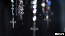 FILE - Crucifix are seen at the Cathedral of Santiago, Chile, May 18, 2018. 