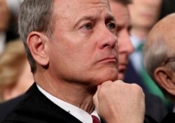 FILE - U.S. Supreme Court Chief Justice John Roberts listens as President Donald Trump delivers his State of the Union address, January 30, 2018. Roberts sided with the majority in Monday's Supreme Court ruling on abortion but did not sign onto their opinion.
