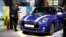 FILE - A MINI Cooper Cabrio is displayed at the China Auto Show in Beijing, China, April 26, 2018. BMW Group and China's biggest SUV brand, Great Wall Motor, announced, July 10, 2018, a partnership to produce electric MINI vehicles in China.