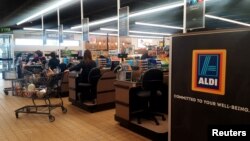 Shoppers are pictured at Aldi, a retail grocery store chain in Wheaton, Illinois, U.S., April 13, 2017.