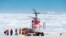 This image taken by expedition doctor Andrew Peacock of www.footloosefotography.com shows a helicopter from the nearby Chinese icebreaker Xue Long picking up the first batch of passengers from the stranded Russian ship MV Akademik Shokalskiy in Antarctica.
