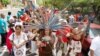 Immigrant rights protesters march to the Arizona Capitol on April 23, 2011 to mark the first anniversary of the passage of some of the broadest and strictest anti-immigration legislation in the United States. (AP)