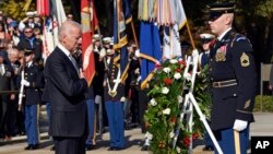 Vice President Joe Biden pauses after laying a wreath at the Tomb of the Unknowns, in honor of Veterans Day, at Arlington National Cemetery in Arlington, Virginia, Nov. 11, 2014. 