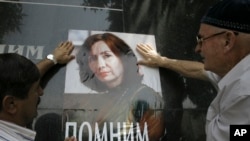 Poster with a photo of Natalya Estemirova, a human rights activist, on a base of a monument to killed journalists in the Chechen capital. (File)