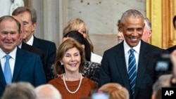 Former President George W. Bush, from left, his wife Laura Bush and former President Barack Obama arrive before the 60th Presidential Inauguration in the Rotunda of the U.S. Capitol in Washington, Jan. 20, 2025.