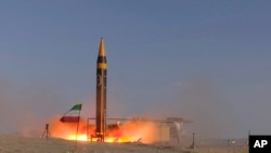 FILE - A missile is launched at an undisclosed location in Iran on May 25, 2023. The U.S. on Oct. 18 imposed sanctions on people and firms tied to the development of Iran's ballistic missile program.