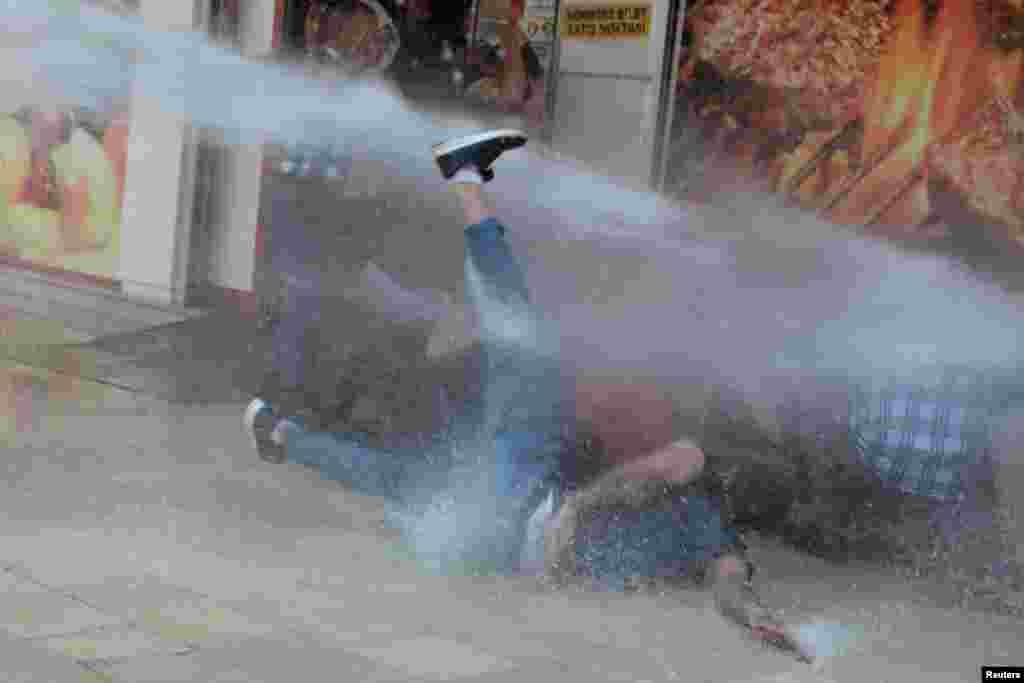 Turkish police use a water cannon to disperse demonstrators during a protest against the replacement of Kurdish mayors with state officials in three cities, in Diyarbakir, Aug. 19, 2019.