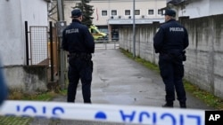 Police secure access to the elementary school where a 7-year-old girl died and a teacher and five other students were wounded in a knife attack in Zagreb, Croatia, on Dec. 20, 2024.