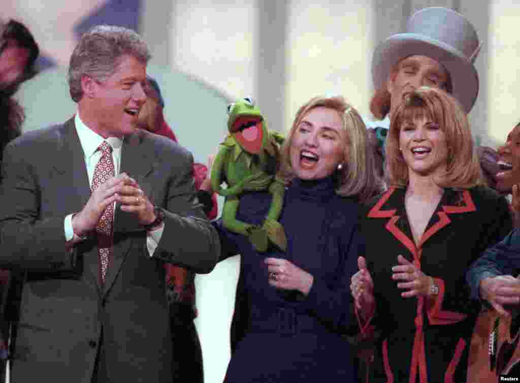 U.S. President Bill Clinton looks on as Sesame Street's Kermit the Frog sings for his wife, Hillary, at the Salute to Youth event at the Kennedy Center in Washington, DC, Jan. 19, 1993.