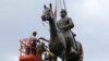 Work crews remove the statue of confederate general Stonewall Jackson, July 1, 2020, in Richmond, Virginia. Richmond Mayor Levar Stoney has ordered the immediate removal of all Confederate statues in the city.