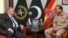 Russian Deputy Prime Minister Alexei Overchuk, left, meets with Pakistan's Army Chief Gen. Asim Munir, in Rawalpindi, Pakistan, Sept. 18, 2024. (Inter Services Public Relations via AP)