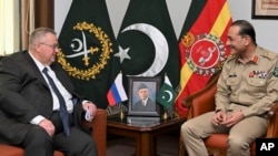 Russian Deputy Prime Minister Alexei Overchuk, left, meets with Pakistan's Army Chief Gen. Asim Munir, in Rawalpindi, Pakistan, Sept. 18, 2024. (Inter Services Public Relations via AP)