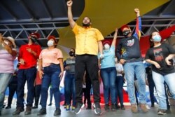 FILE - Nicolas Maduro Guerra, son of Venezuela's President Nicolas Maduro, campaigns for a spot in the National Assembly for the Dec. 6 midterm elections, in Maiquetía, Venezuela, Nov. 29, 2020.