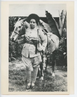 A female soldier poses with her horse. (From the collection of Maaza Mengiste)