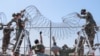 U.S. Marines set up razor wire to expand the Illegal Alien Holding Operations Center at Naval Station Guantanamo Bay, Cuba, Feb. 8, 2025. 