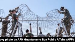 U.S. Marines set up razor wire to expand the Illegal Alien Holding Operations Center at Naval Station Guantanamo Bay, Cuba, Feb. 8, 2025. 