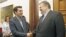 Socialist PASOK party leader Evangelos Venizelos (R) and Greece's Left Coalition party head Alexis Tsipras shake hands during their meeting at the parliament in Athens, May 11, 2012.