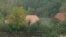 Several buildings are seen where a group of people were discovered to be living in secluded conditions, in Ruinerwold, 130 kilometers (80 miles) northeast of Amsterdam, Netherlands, Oct. 15, 2019. 