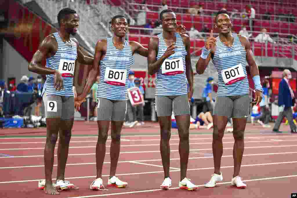 The team from Botswana poses after a heat in the men's 4 x 400-meter relay at the 2020 Summer Olympics, Friday, Aug. 6, 2021, in Tokyo. (AP Photo/Matthias Schrader)