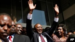 Kenyan president elect Uhuru Kenyatta waves at supporters after winning the elections in Nairobi, Mar. 9, 2013. Kenya's election commission posted complete results early Saturday showing that Deputy Prime Minister Uhuru Kenyatta prevailed in the country'