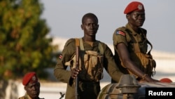 FILE - SPLA soldiers stand in a vehicle in Juba, Dec. 20, 2013. The Sudan People's Liberation Army is accused of attacking civilians over the weekend. A spokesman denies the allegations.