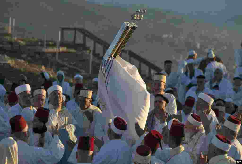 Samaritans pray on top of Mount Gerizim, near the northern West Bank city of Nablus, during celebrations for the holiday of Sukkot (the Tabernacles Feast), which marks the exodus of the ancient Hebrew people from Egypt.