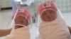 Nurses hold newborn babies wearing protective face shields at the Praram 9 hospital in Bangkok, Thailand, during the coronavirus disease (COVID-19) outbreak.