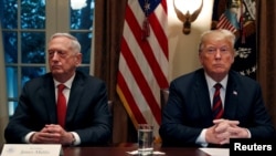 FILE - President Trump gets a briefing from his senior military leaders, including Defense Secretary James Mattis (L), in the Cabinet Room at the White House, October 23, 2018.