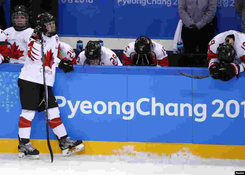 Team Canada players react on the bench at the end of the women's gold medal hockey game in Gangneung, South Korea, Feb. 22, 2018.