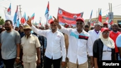 FILE - Freeman Mbowe, chairman of Chadema, Tanzania's main opposition party, leads members of the opposition parties to reduce presidential powers and reform the electoral commission ahead of a general election due next year, in Dar es Salaam, Tanzania January 24, 2024.