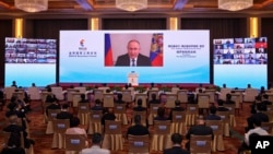 Владимир Путин выступает на церемонии открытия Бизнес-форума БРИКС в Пекине, 22 июня 2022 года