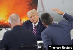 President Trump participates in a briefing on wildfires in McClellan Park in McClellan Park, California.