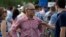 FILE - Environmental Protection Agency Administrator Scott Pruitt stands on the South Lawn during an afternoon picnic for military families at the White House, July 4, 2018, in Washington. 