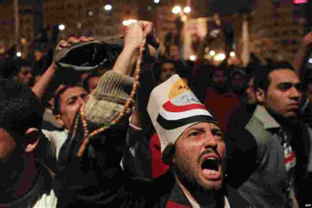 Anti-government protesters react to Egyptian President Hosni Mubarak's televised statement to his nation in Tahrir Square in downtown Cairo, Egypt Thursday, Feb. 10, 2011. Egyptian President Hosni Mubarak announced he is handing his powers over to his vi