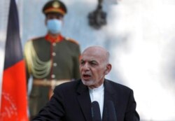 FILE - Afghan President Ashraf Ghani speaks during a joint news conference with Pakistan Prime Minister Imran Khan at the Presidential Palace in Kabul, Afghanistan, Nov. 19, 2020.