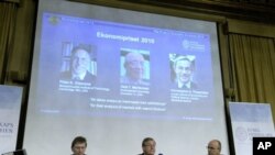 Seated, from L-R: Professor Bertil Holmlund, Permanent secretary of the Royal Academy of Sciences Staffan Normark (C) and Professor Per Krusell announce the Nobel Prize in Economic Sciences. Stockholm, 11 Oct 2010